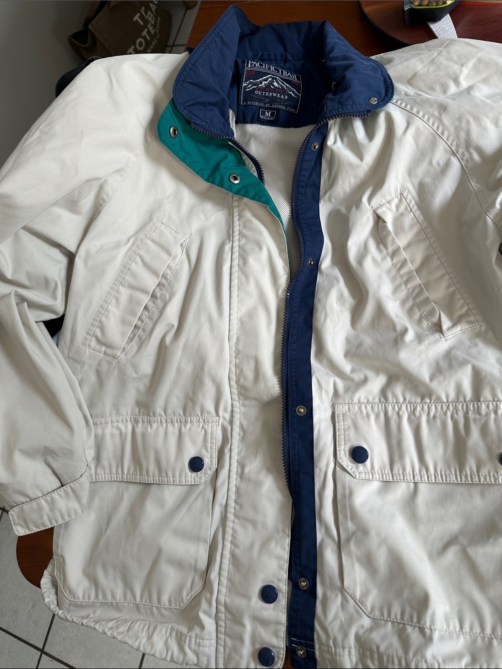 Pacific Trail Off-White Jacket with Navy Trim and Teal Accent